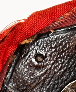 View of exterior red fabric & A hole where a decorative do would’ve been